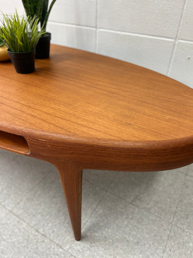 Oval teak coffee table