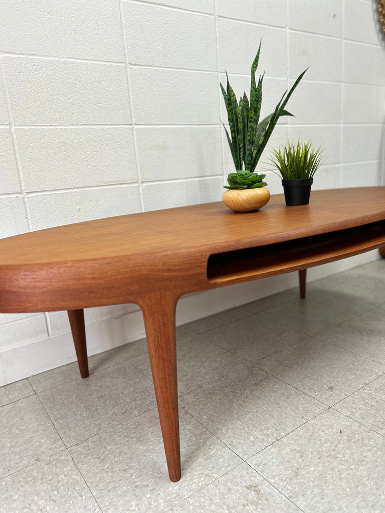 Oval teak coffee table