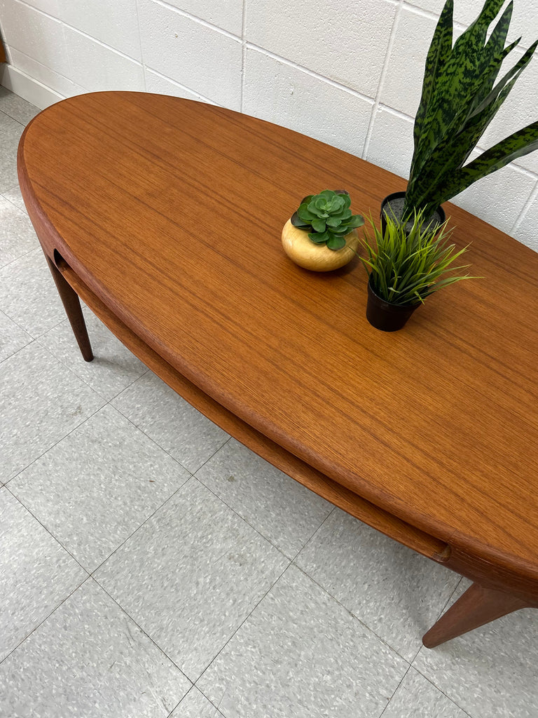 Oval teak coffee table